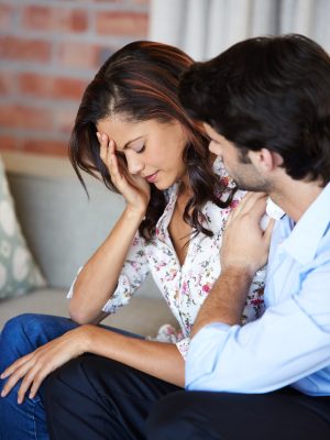 couple-sad-woman-man-with-support-home-comfort-depression-couch-infertility-crying-unhappy-people-with-fear-stress-problem-with-marriage-relationship-apartment Couple, sad woman and man with support in home for comfort and depression on couch. Infertility, crying and unhappy people with fear, stress and problem with marriage or relationship in apartment.
